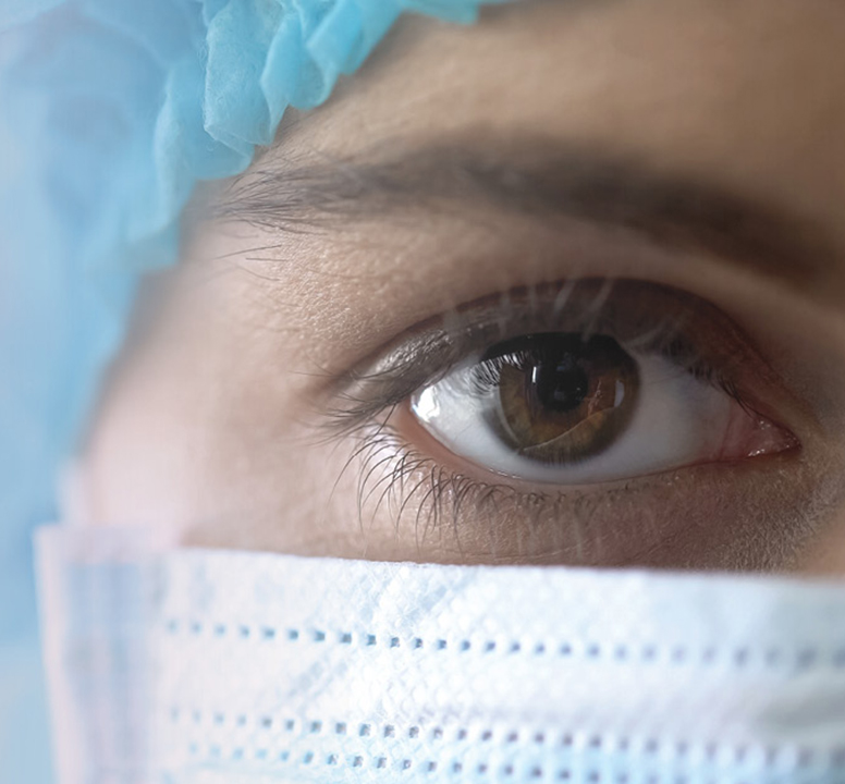 Close up image of a nurse with a mask on